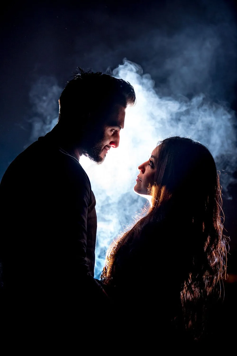 Couple silhouetted at night